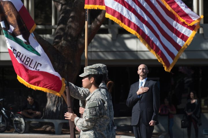 Harwood Garland saluting American flag
